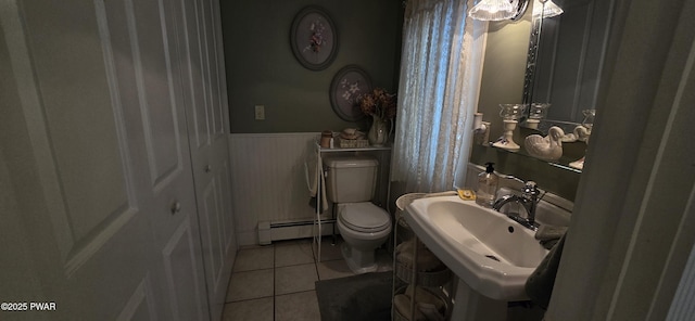 300 W High St, Milford, PA 18337 - bathroom featuring a baseboard radiator, wainscoting, and tile patterned floors
