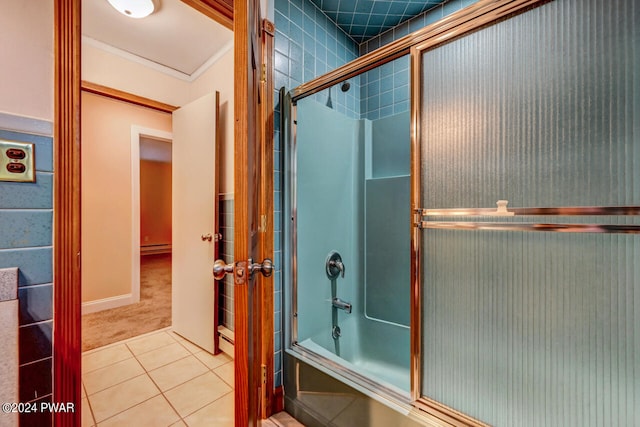 bathroom featuring tile patterned floors and bath / shower combo with glass door