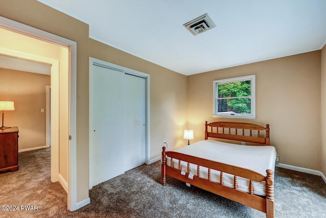 carpeted bedroom featuring a closet