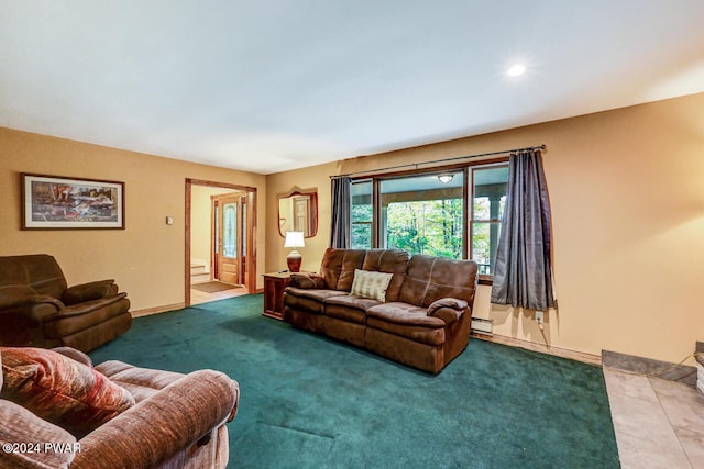 living room with carpet and a baseboard heating unit