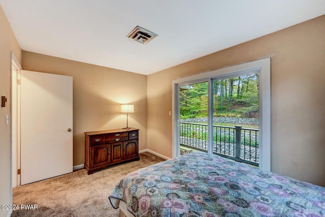 carpeted bedroom featuring access to outside