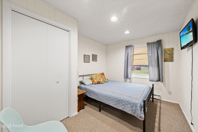 114 Orchard Dr, Lords Valley, PA 18428 - bedroom featuring carpet, recessed lighting, a textured ceiling, a closet, and a baseboard heating unit