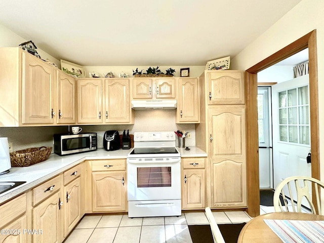 121 Canterbrook Dr, Hawley, PA 18428 - kitchen with electric stove, stainless steel microwave, light brown cabinets, under cabinet range hood, and light countertops