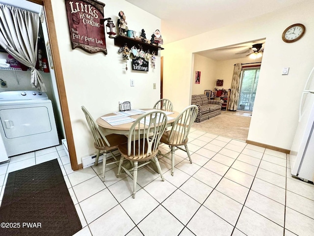 121 Canterbrook Dr, Hawley, PA 18428 - dining room with washer / clothes dryer, light tile patterned floors, a baseboard radiator, and ceiling fan