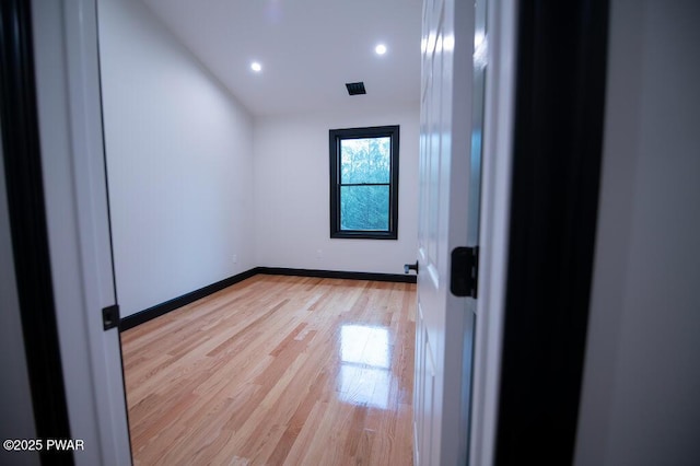 unfurnished room featuring visible vents, recessed lighting, light wood-style floors, and baseboards