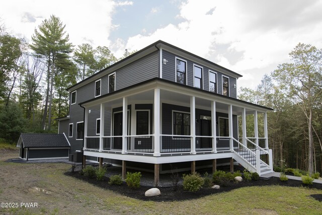 exterior space featuring an outbuilding and covered porch