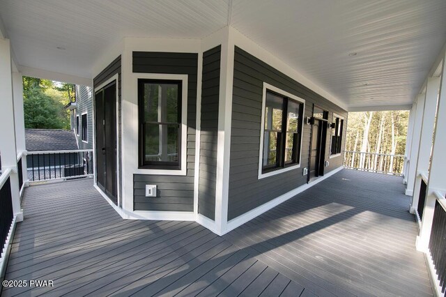 wooden deck featuring covered porch