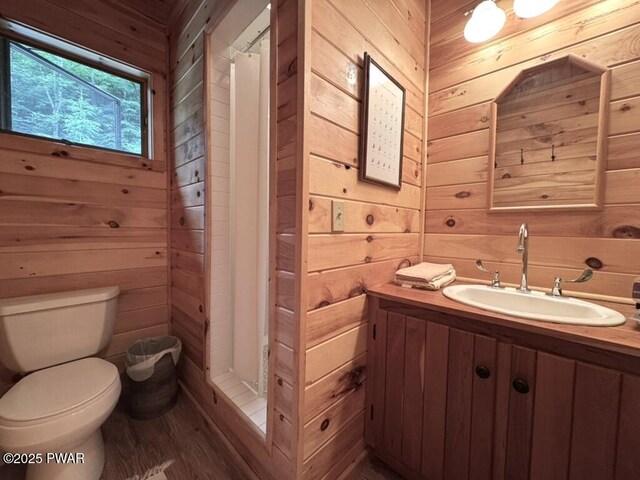 498 Penn York Rd, Starlight, PA 18461 - bathroom with wooden walls, vanity, wood finished floors, and curtained shower