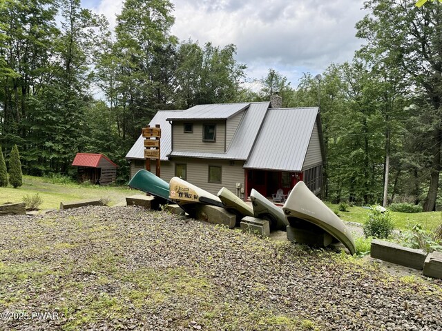498 Penn York Rd, Starlight, PA 18461 - back of property with a chimney and a metal roof