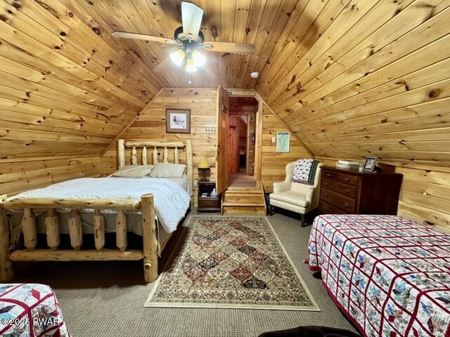 498 Penn York Rd, Starlight, PA 18461 - bedroom featuring wood walls, wood ceiling, carpet floors, lofted ceiling, and a ceiling fan