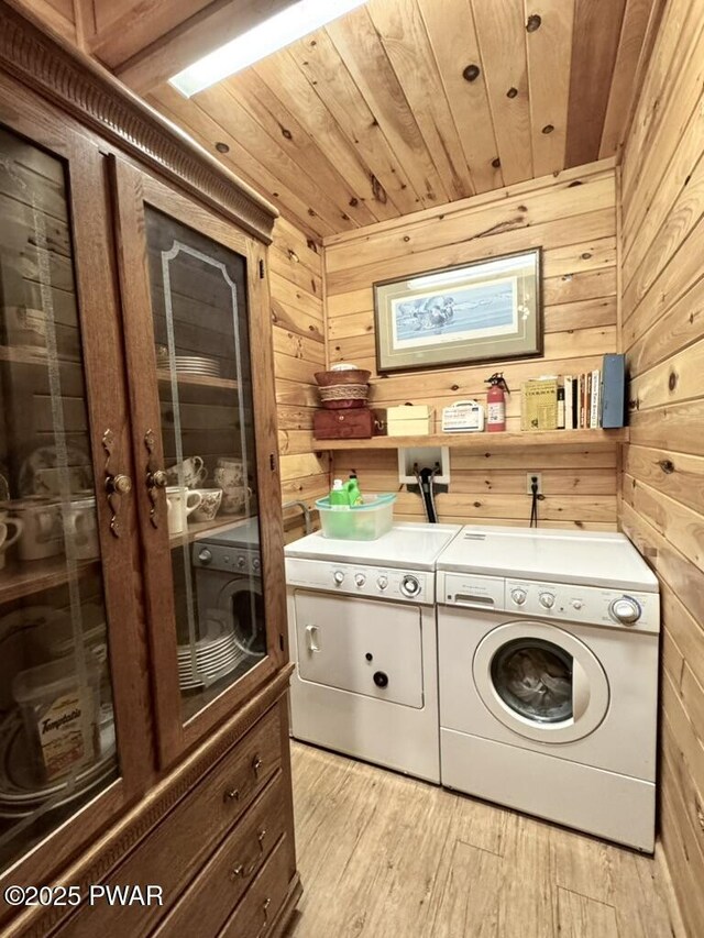 498 Penn York Rd, Starlight, PA 18461 - laundry room featuring washing machine and clothes dryer, wooden ceiling, wood walls, and light wood-style floors