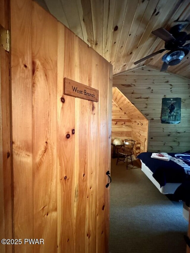 498 Penn York Rd, Starlight, PA 18461 - unfurnished bedroom featuring wood walls, carpet floors, vaulted ceiling, and wood ceiling