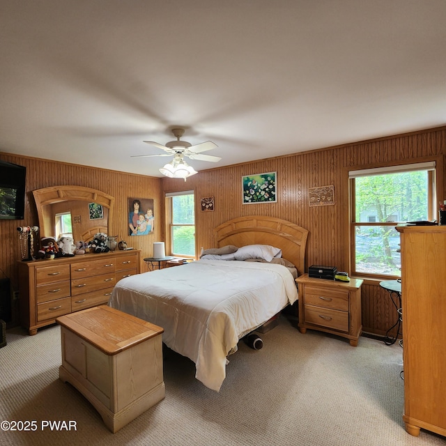 344 Canoebrook Dr, Lords Valley, PA 18428 - bedroom featuring light colored carpet, wooden walls, and ceiling fan