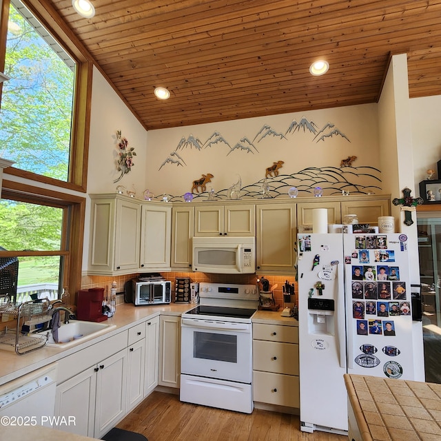 344 Canoebrook Dr, Lords Valley, PA 18428 - kitchen featuring white appliances, wood ceiling, light countertops, high vaulted ceiling, and a sink