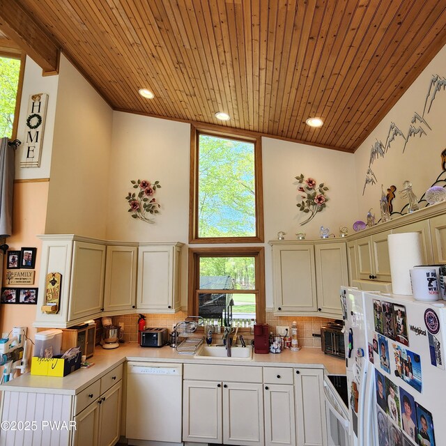 344 Canoebrook Dr, Lords Valley, PA 18428 - kitchen featuring white appliances, a sink, wood ceiling, light countertops, and decorative backsplash