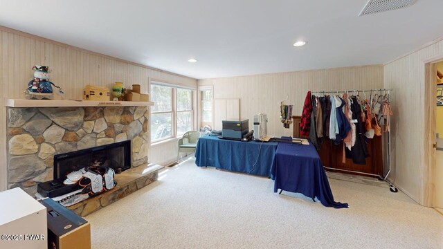 344 Canoebrook Dr, Lords Valley, PA 18428 - carpeted bedroom featuring a stone fireplace, wood walls, and recessed lighting