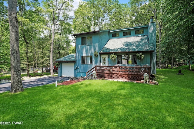 103 Westfall Dr, Dingmans Ferry, PA 18328 - view of front of property with covered porch, asphalt driveway, a chimney, a front lawn, and roof with shingles
