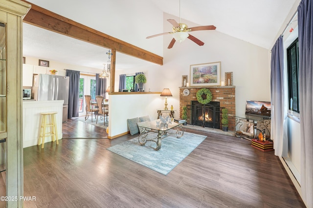 103 Westfall Dr, Dingmans Ferry, PA 18328 - living room featuring a ceiling fan, a fireplace, wood finished floors, high vaulted ceiling, and a chandelier