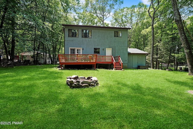 103 Westfall Dr, Dingmans Ferry, PA 18328 - rear view of house featuring a deck and a yard