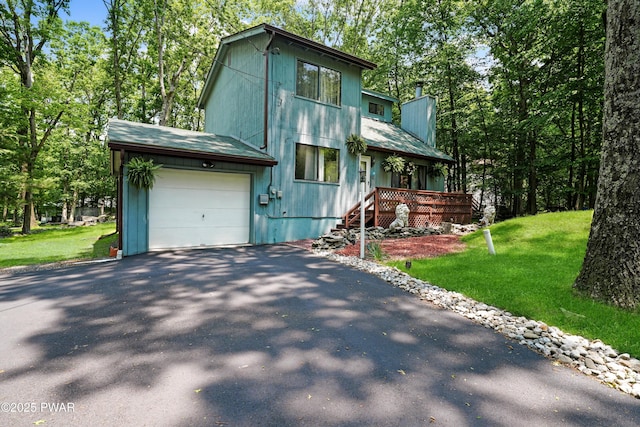 103 Westfall Dr, Dingmans Ferry, PA 18328 - rustic home with asphalt driveway, a garage, a chimney, and a front lawn