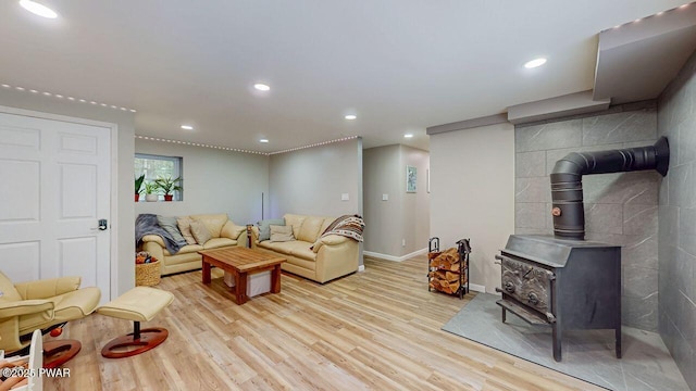 142 Myck Rd, Dingmans Ferry, PA 18328 - living room with wood finished floors, a wood stove, and recessed lighting