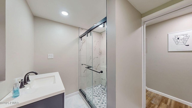 142 Myck Rd, Dingmans Ferry, PA 18328 - bathroom with a shower stall, vanity, wood finished floors, and recessed lighting