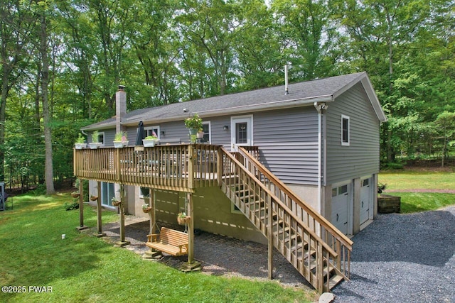142 Myck Rd, Dingmans Ferry, PA 18328 - rear view of property with a garage, a wooden deck, a lawn, and stairway