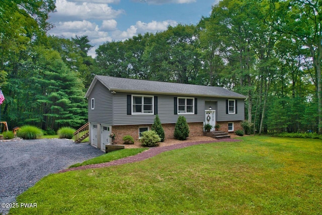 142 Myck Rd, Dingmans Ferry, PA 18328 - raised ranch with a garage, gravel driveway, a front lawn, and brick siding