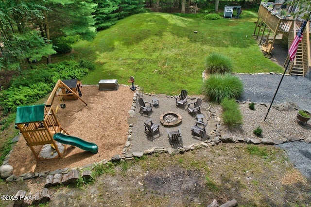 142 Myck Rd, Dingmans Ferry, PA 18328 - view of green lawn featuring a fire pit, a playground, and stairs