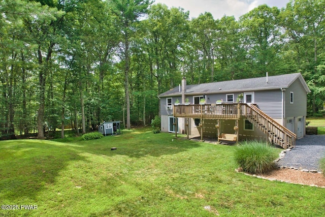 142 Myck Rd, Dingmans Ferry, PA 18328 - rear view of house featuring a deck, a storage unit, a yard, and stairs