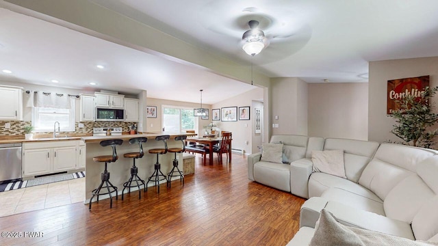 142 Myck Rd, Dingmans Ferry, PA 18328 - living area featuring ceiling fan, light wood finished floors, recessed lighting, and vaulted ceiling