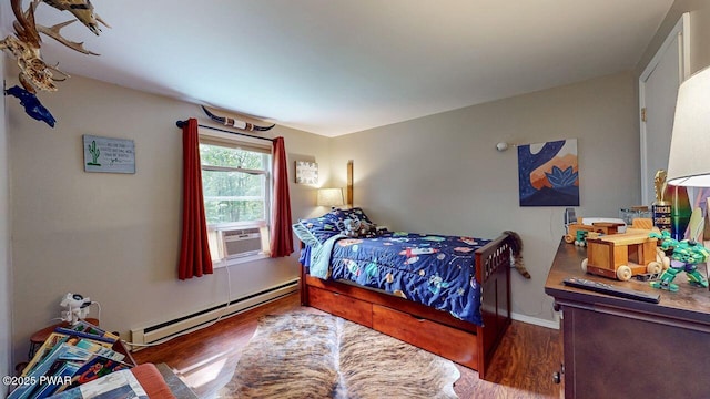 142 Myck Rd, Dingmans Ferry, PA 18328 - bedroom featuring a baseboard heating unit, cooling unit, and wood finished floors