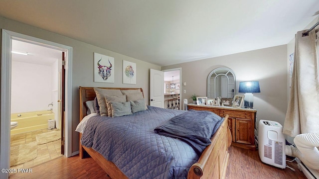 142 Myck Rd, Dingmans Ferry, PA 18328 - bedroom with ensuite bathroom and wood finished floors