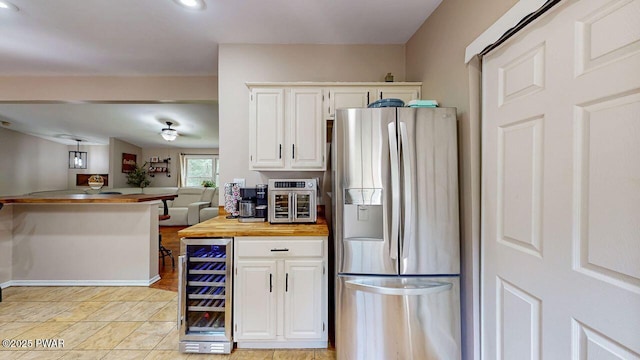 142 Myck Rd, Dingmans Ferry, PA 18328 - kitchen featuring stainless steel refrigerator with ice dispenser, beverage cooler, white cabinetry, open floor plan, and recessed lighting