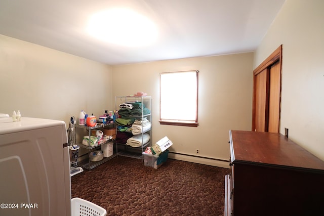 interior space with washer / clothes dryer and a baseboard radiator