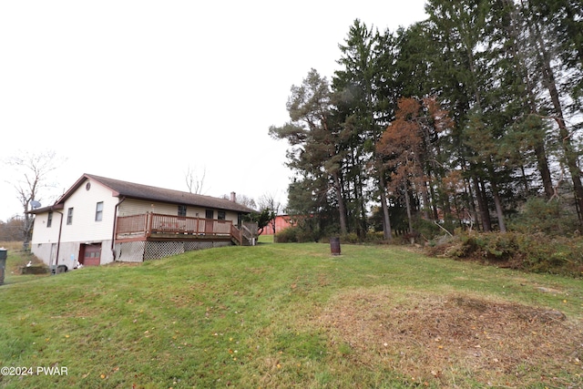 view of yard featuring a wooden deck