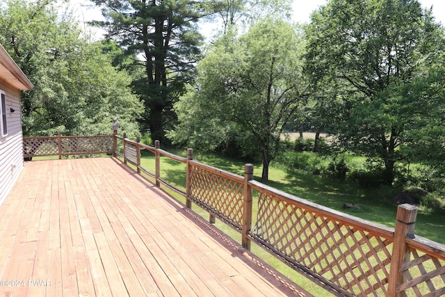 wooden terrace with a yard