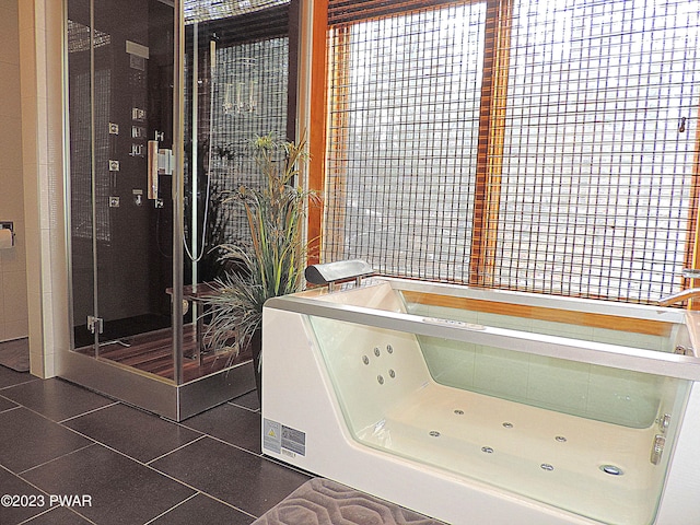 bathroom with tile patterned flooring and washer / dryer