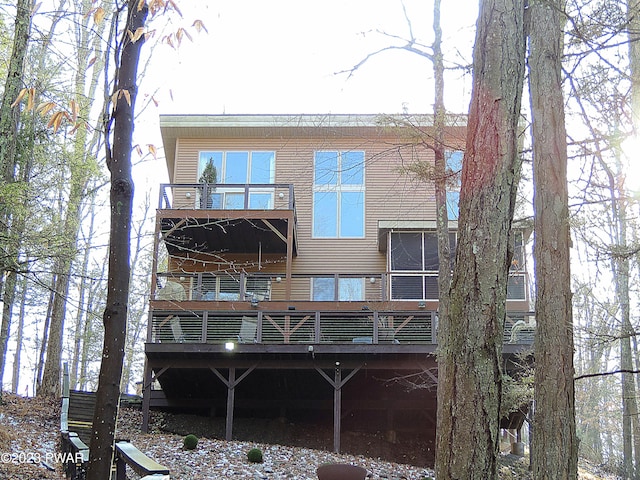 rear view of house featuring a balcony