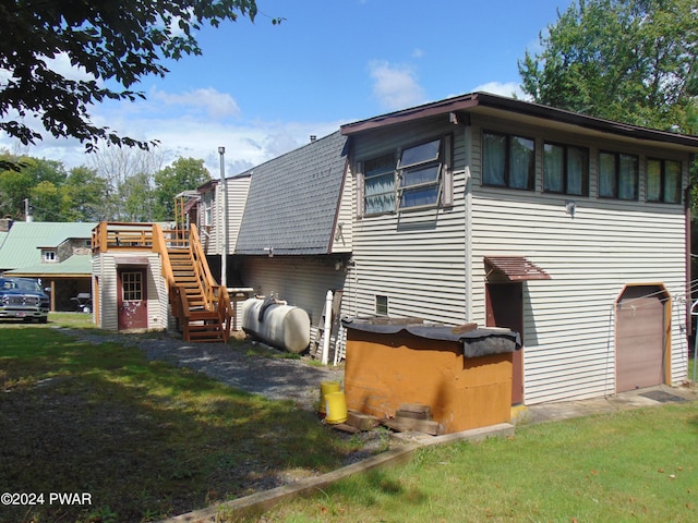 back of house with a yard