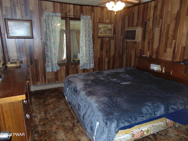 bedroom with wood walls, dark carpet, ceiling fan, a wall mounted AC, and a baseboard radiator