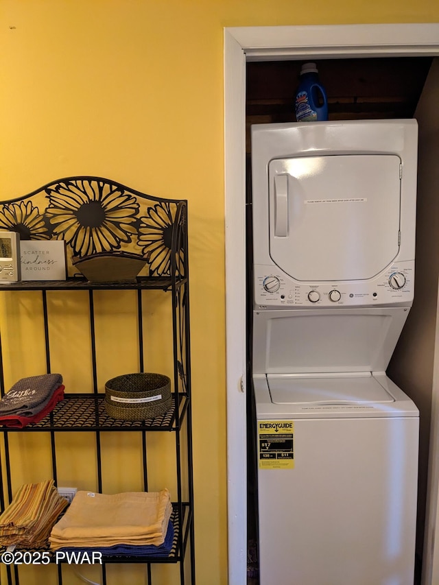 laundry area featuring stacked washer and dryer