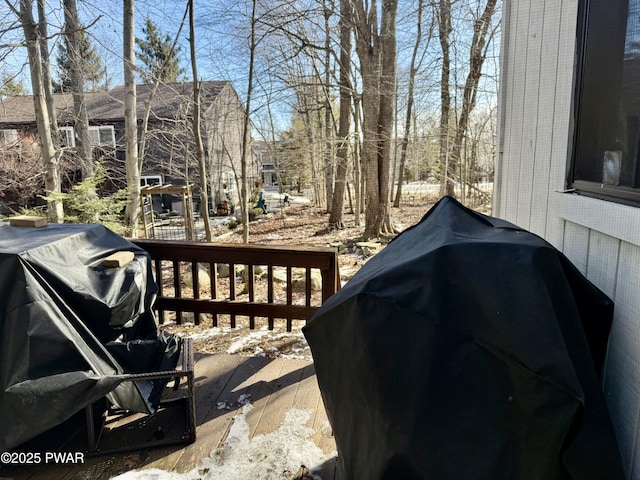 view of patio featuring a wooden deck and grilling area