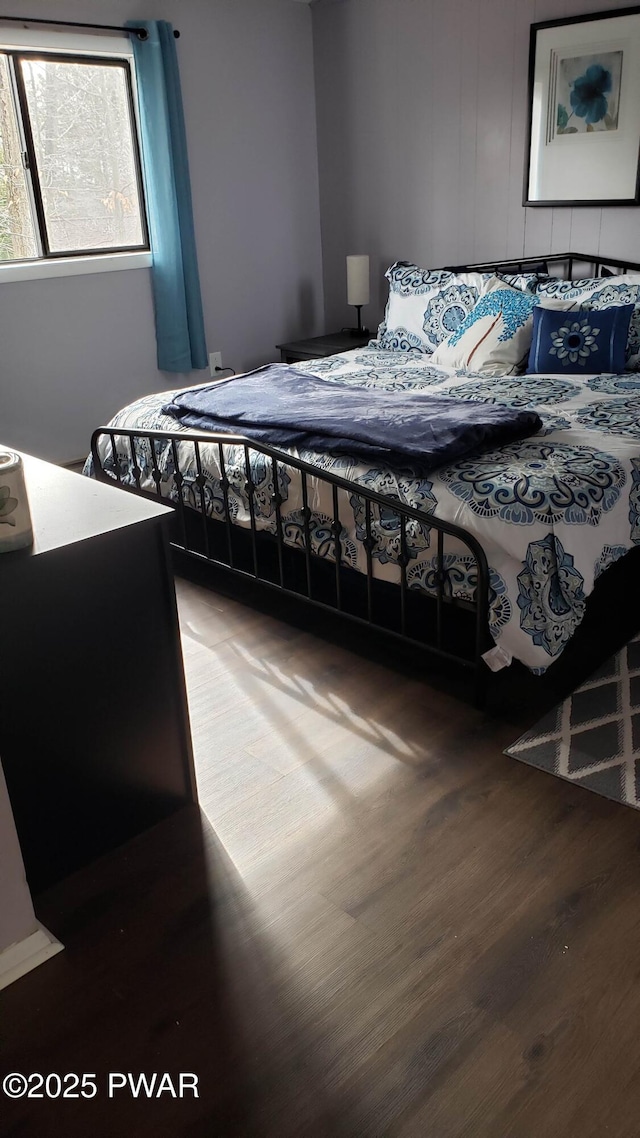 bedroom featuring wood-type flooring