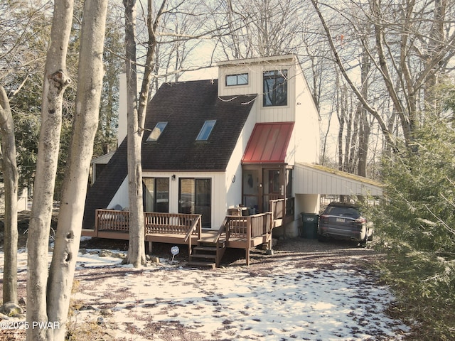 view of front of house with a carport and a deck