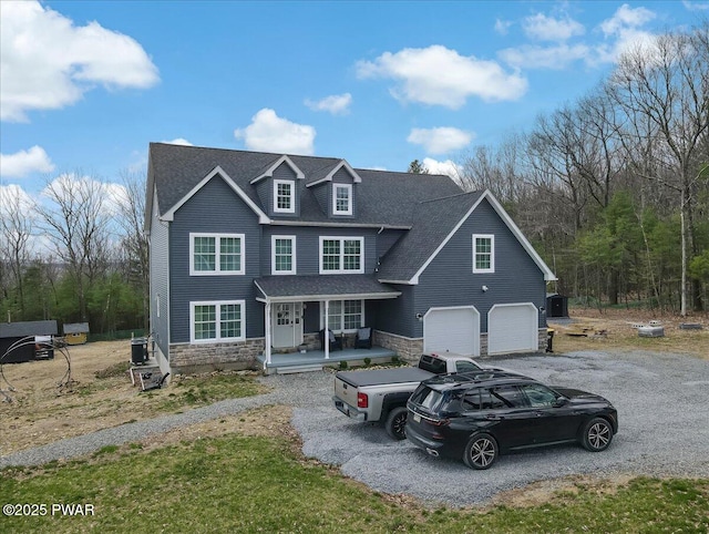 116 Red Bud Ln, Kunkletown, PA 18058 - view of front of property featuring a porch, stone siding, driveway, and an attached garage