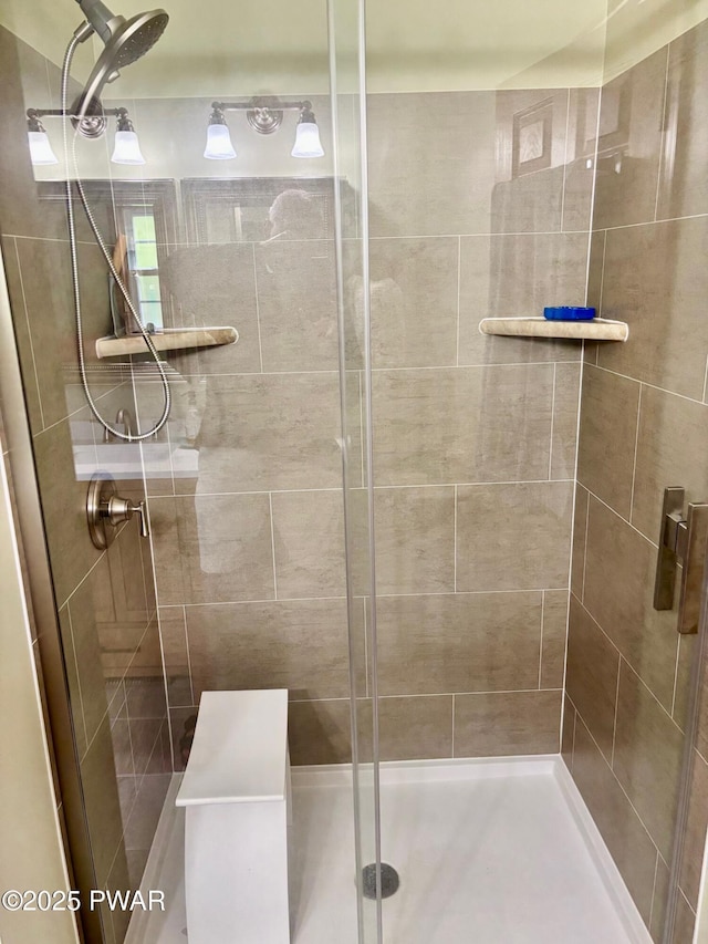 bathroom featuring a shower stall