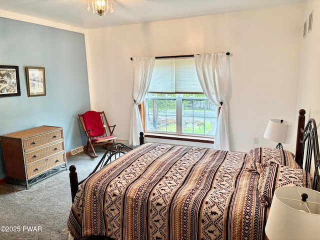 bedroom featuring baseboards, visible vents, and carpet floors
