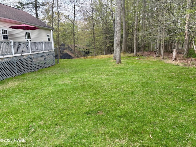 view of yard with a wooden deck