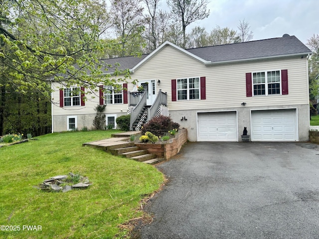 view of front of house with a garage, a shingled roof, driveway, and a front lawn